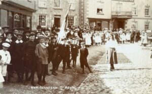 Churchtown in 1911 showing the McAdamised road surface. The road is clearly higher in the middle to allow water to run into the roadside ditch where a boy stands.