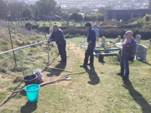 Handrail team in action Phillack Church Cemetery